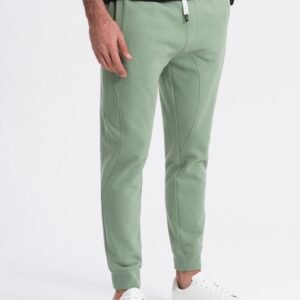 Zelené tepláky s trendy prešívaním V3 PABS-0173